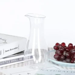 Transparent akryl juiceflaska - elegant dryckesbehållare för bar och hem