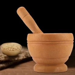 Vitlökskvarn i plast - köksredskap för att mala kryddor och örter